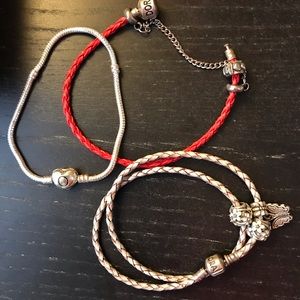 3 pandora bracelets one comes with beads.